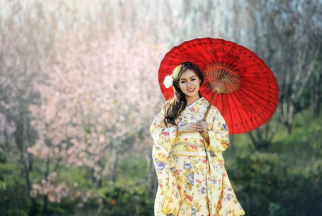 Гейша Японии с зонтиком