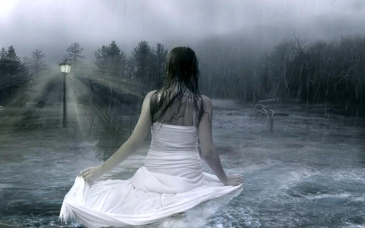 Девушка в белом платье под дождём