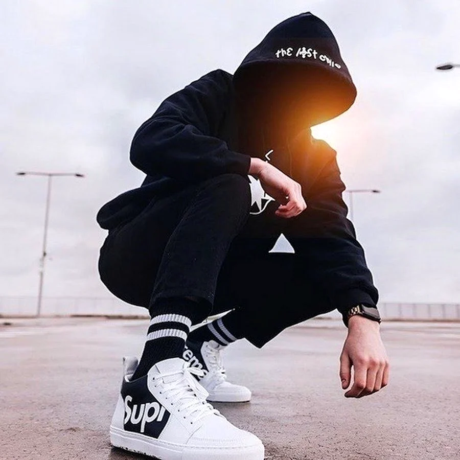 Black and White Photo of Man in Nike Hoodie